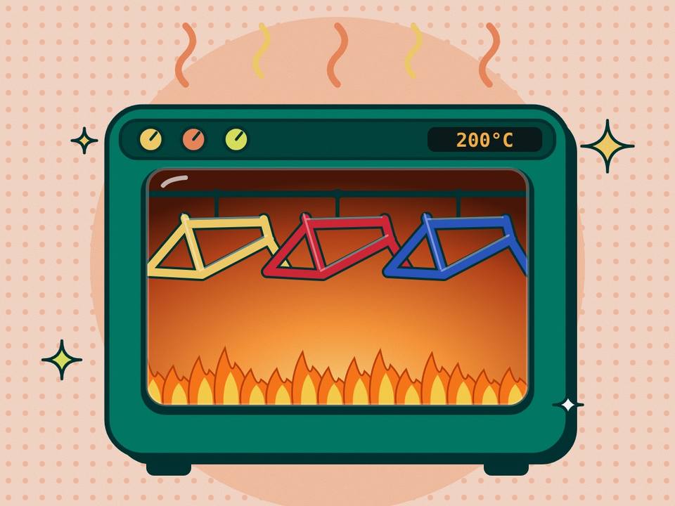 Horno de pintura con cuadros de bicicleta de colores colgados y llamas